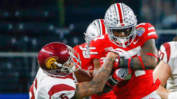 USC's Michael Pittman tries to strip Ohio State's Jerome Baker.
